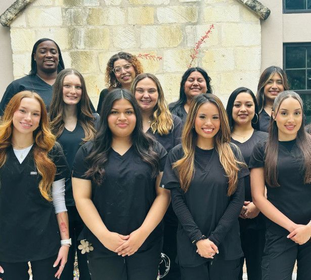 Dental Assistant School Students posing for photo outside of training facility.